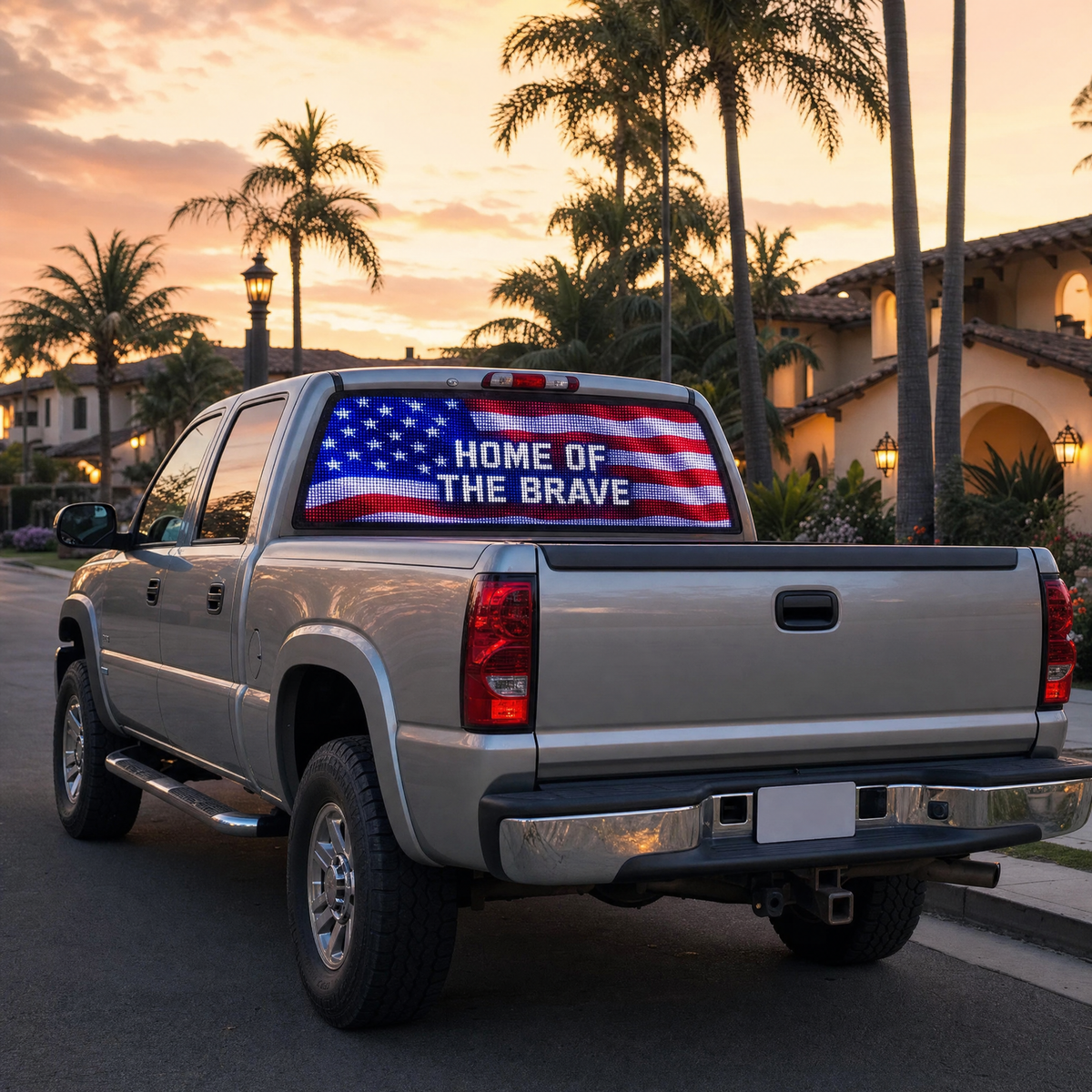HOME OF THE BRAVE design on a silver pickup at sunset